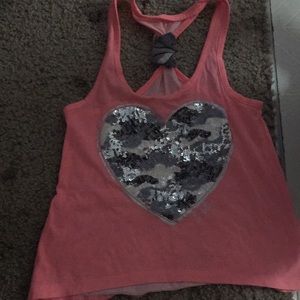 A nice peach colored tank top that’s from justice